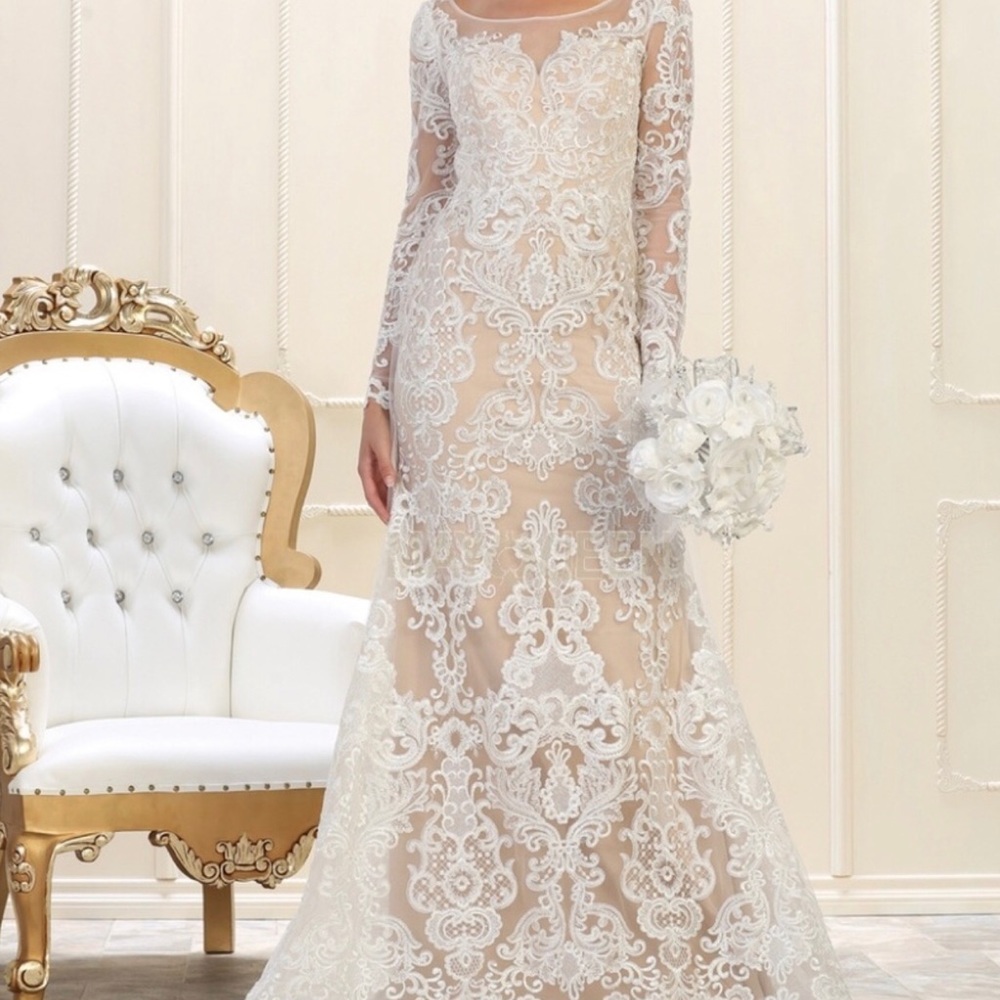 Brand new never worn wedding dress. Comes with garment bag